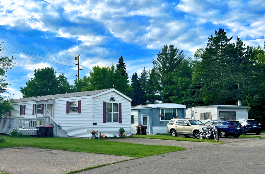 Braham Mobile Home Community houses and cars in driveways